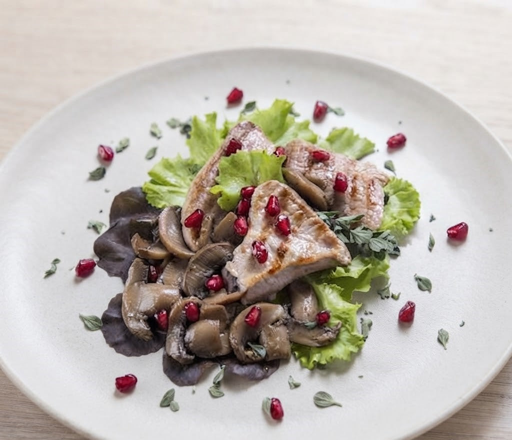 Controfiletto di vitello ai funghi champignon e melograno